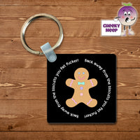 Black square keyring with the words Back away from the biscuits you fat fucker printed surrounding a picture of a decorated gingerbread man. As supplied by Cheekyneep.com