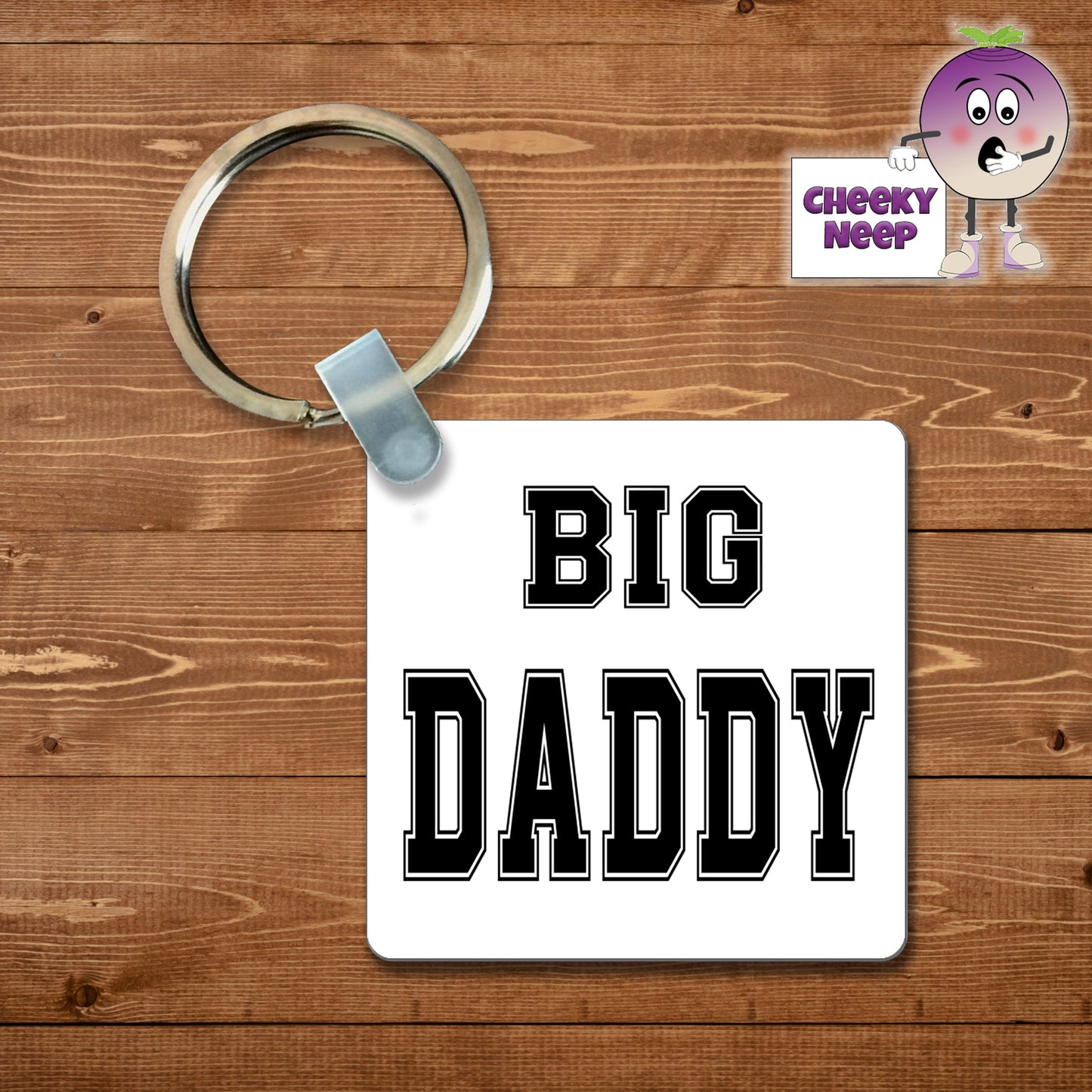 Square plastic keyring with the words "Big Daddy" printed on both sides.