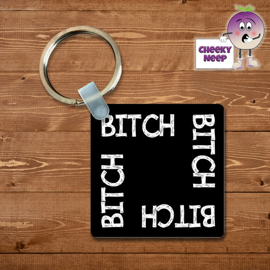 Black square keyring with the words "Bitch" printed four times on the keyring. As supplied by Cheekyneep.com