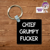 Black square plastic keyring with the words Chief Grumpy Fucker printed on the keyring as supplied by Cheekyneep.com