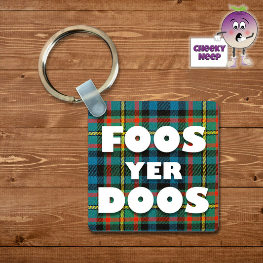 Square plastic keyring with the words "Foos Yer Doos" printed on both sides.