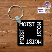 Black square keyring with the word 