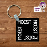 Black square keyring with the word "Moist" printed on the keyring four times as supplied by Cheekyneep.com