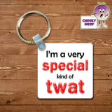 Square plastic keyring with the words "I'm a very special kind of twat" printed on both sides.