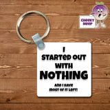 Square plastic keyring with the words "I started out with nothing (and have most of it left)" printed on both sides.