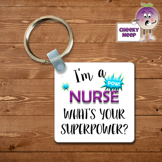 Square plastic keyring with the words "I'm a nurse what's your superpower?" printed on both sides.