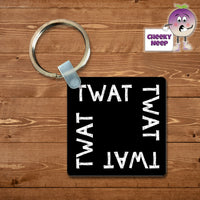 Black square keyring with the word 