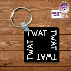 Black square keyring with the word "Twat" printed four times on the keyring as supplied by Cheekyneep.com