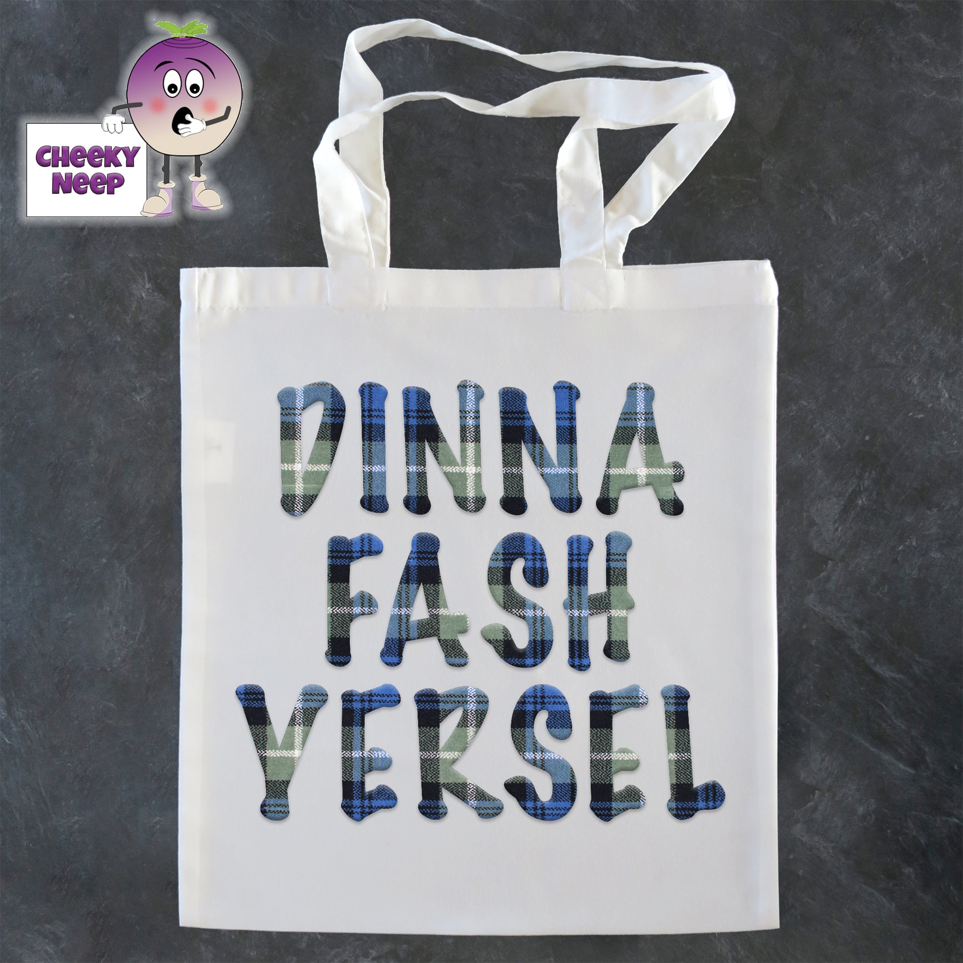   Tote Shopping bag in white with the words "Dinna Fash Yersel" printed on the bag