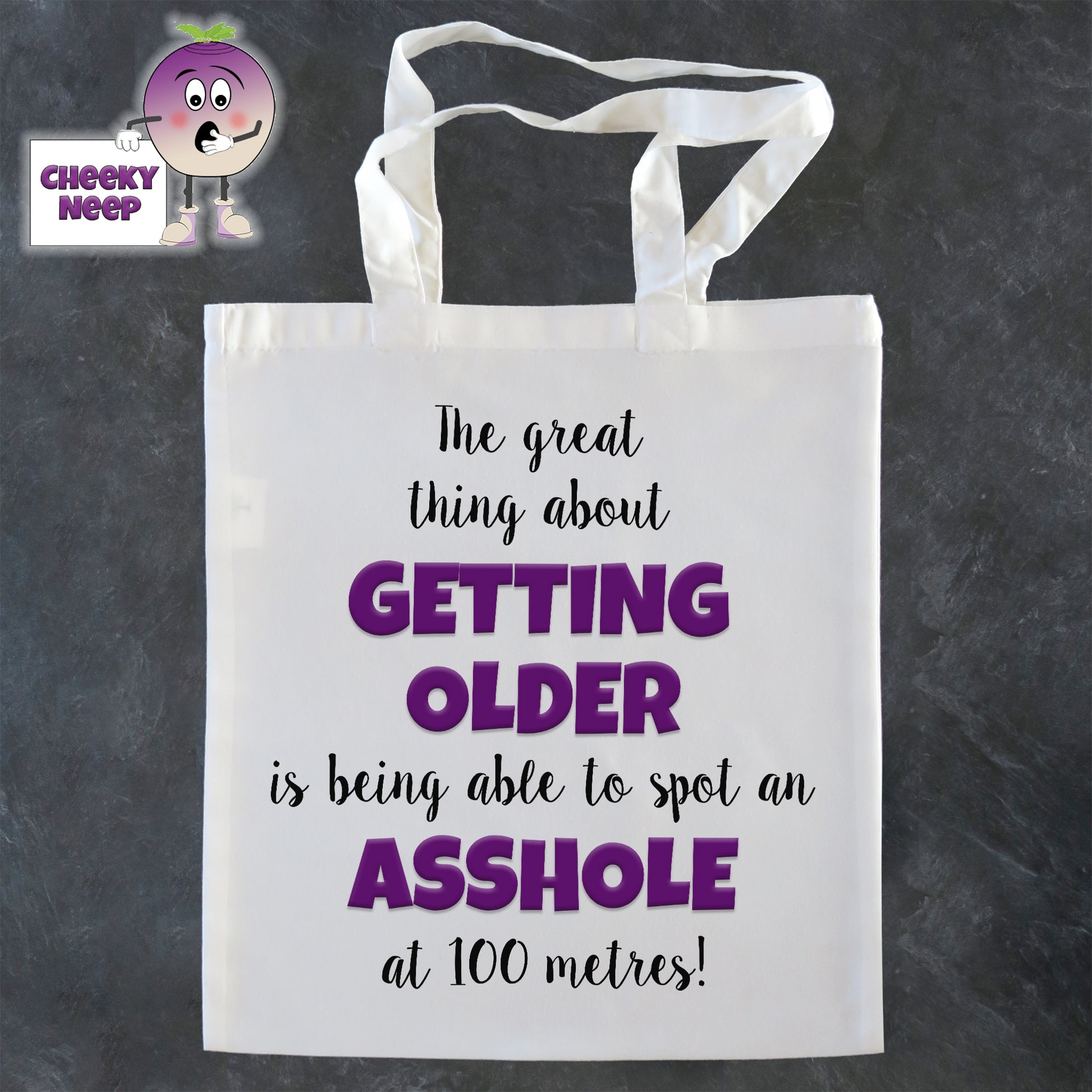 Tote Shopping bag in white with the words "The great thing about GETTING OLDER Is being able to spot an ASSHOLE at 100 metres!" printed on the bag